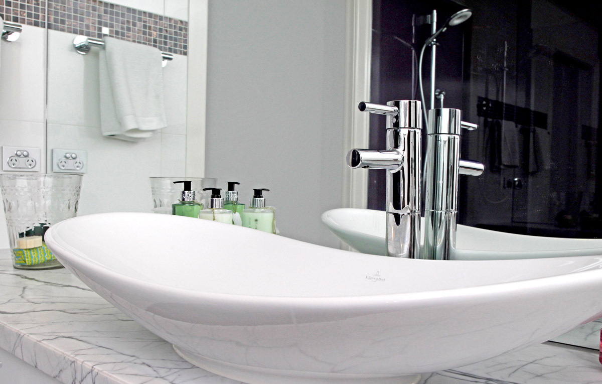 Frameless mirror in modern bathroom.